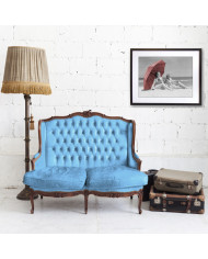 Two women sitting on beach under parasol,1930