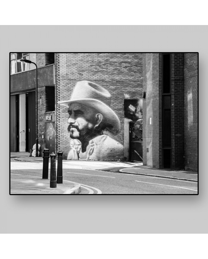 Graffiti de un cowbow en Hewlett Street, Londres, UK