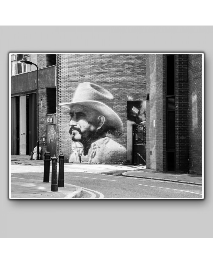 Graffiti de un cowbow en Hewlett Street, Londres, UK