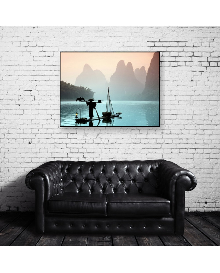 Pescador chino con un cormorán, China