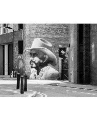 Graffiti de un cowbow en Hewlett Street, Londres, UK