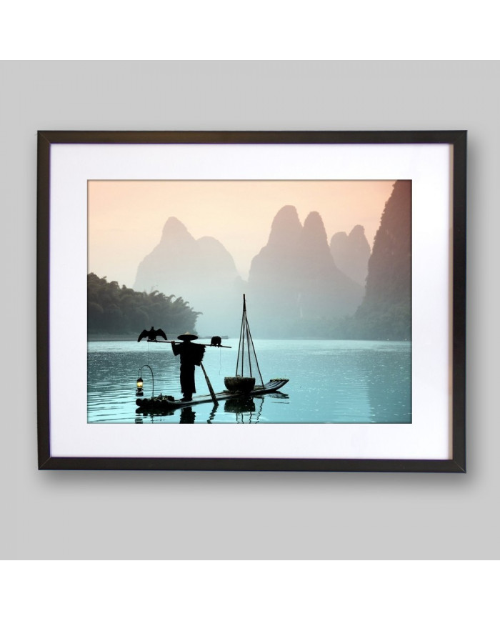 Pescador chino con un cormorán, China