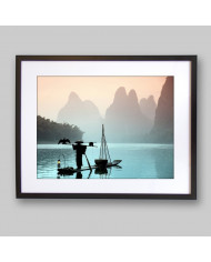 Pescador chino con un cormorán, China