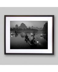 Pescador con cormoranes en el Río Li,China